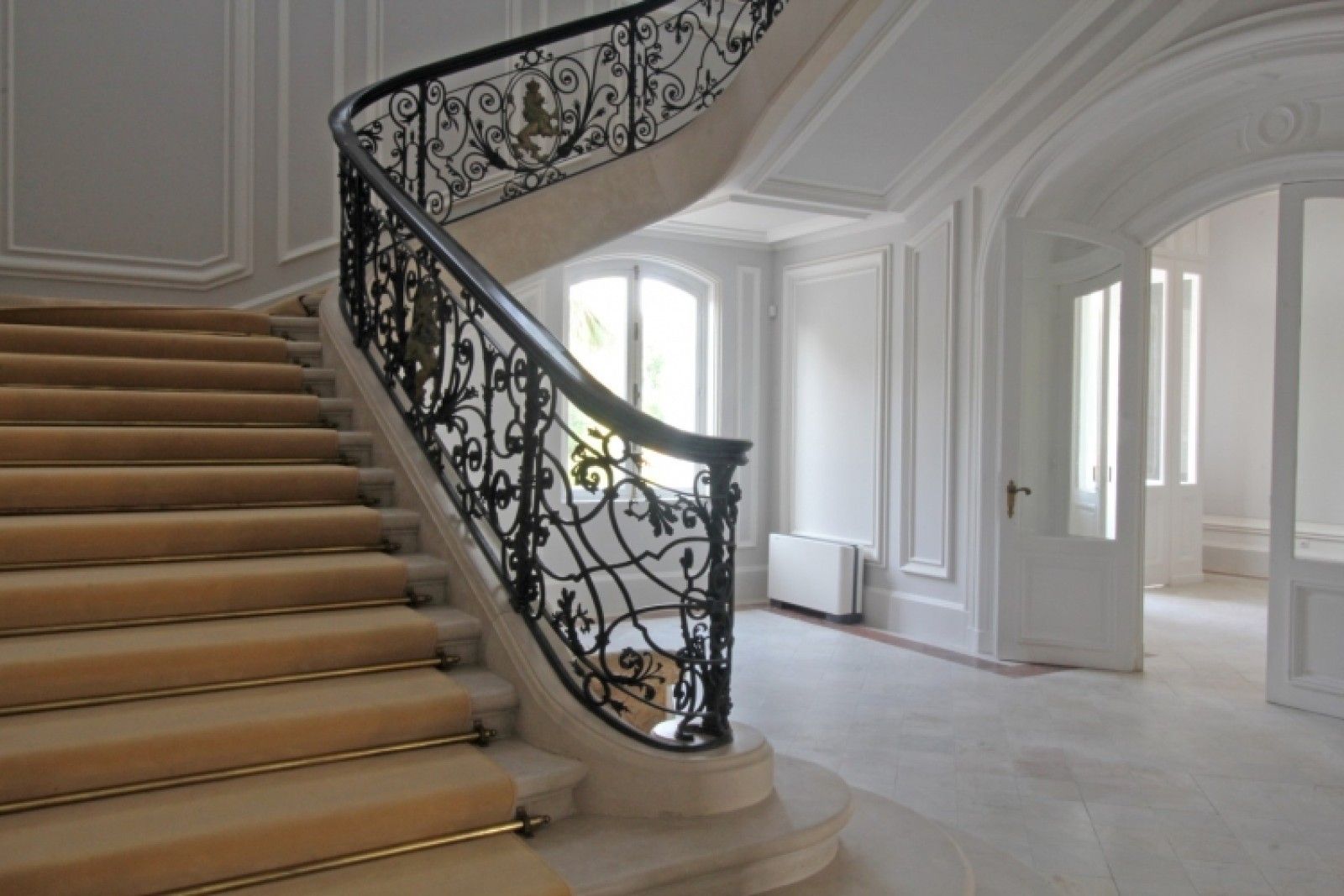 Palace in Louis XIII French château style characterized by jointed brickwork, a high mansard roof with copper cladding and a clock tower.