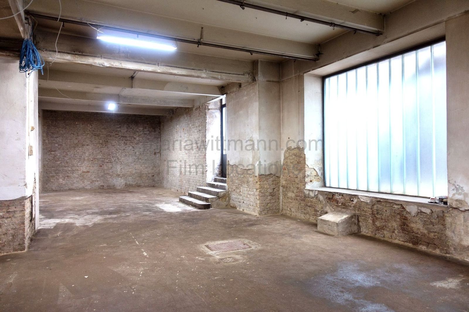 Raw Industrial Loft with Exposed Concrete and Brick - Photo 12