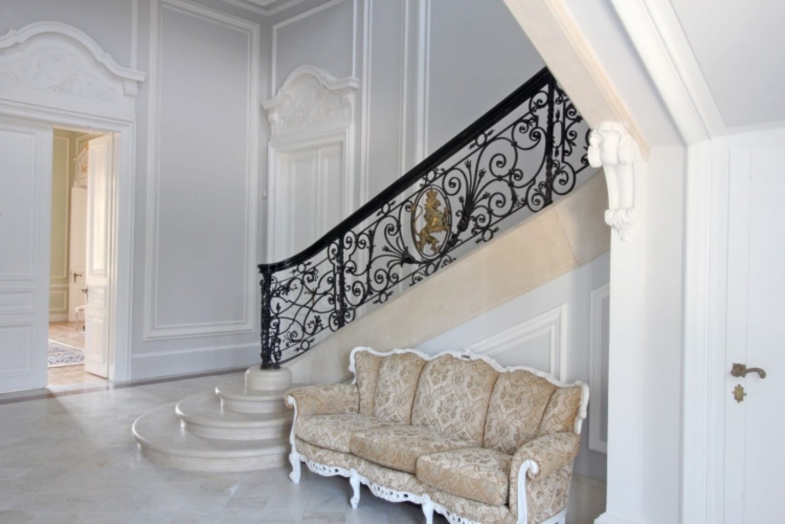 Palace in Louis XIII French château style characterized by jointed brickwork, a high mansard roof with copper cladding and a clock tower.