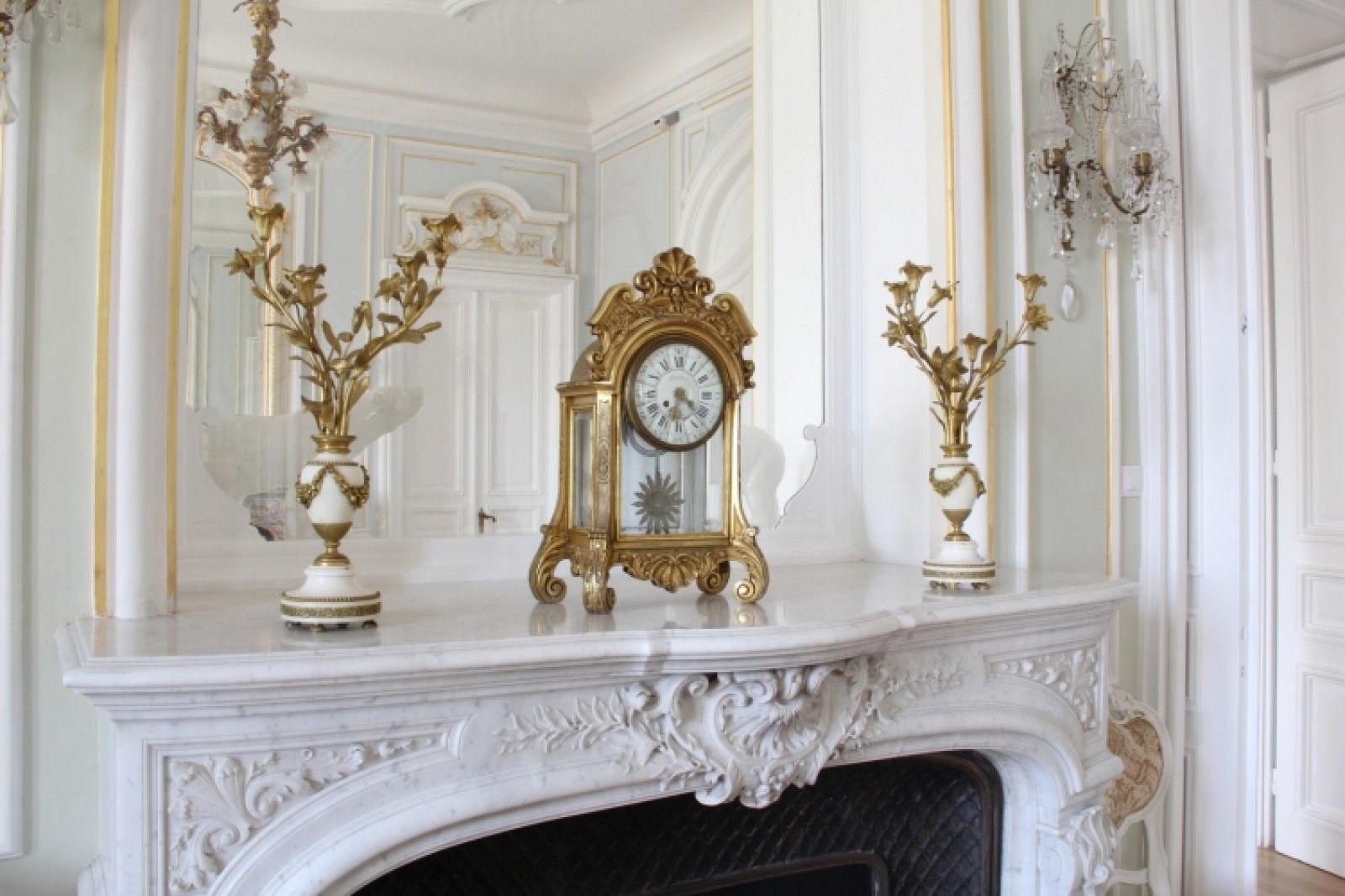 Palace in Louis XIII French château style characterized by jointed brickwork, a high mansard roof with copper cladding and a clock tower.