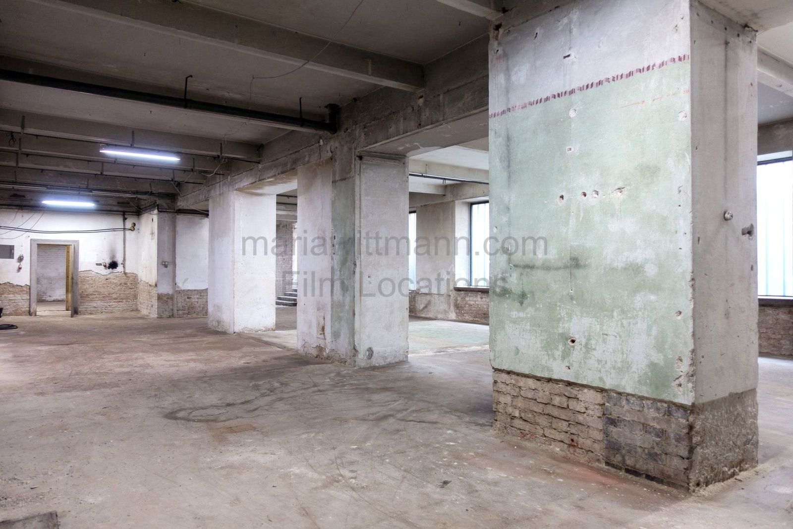 Raw Industrial Loft with Exposed Concrete and Brick - Photo 7