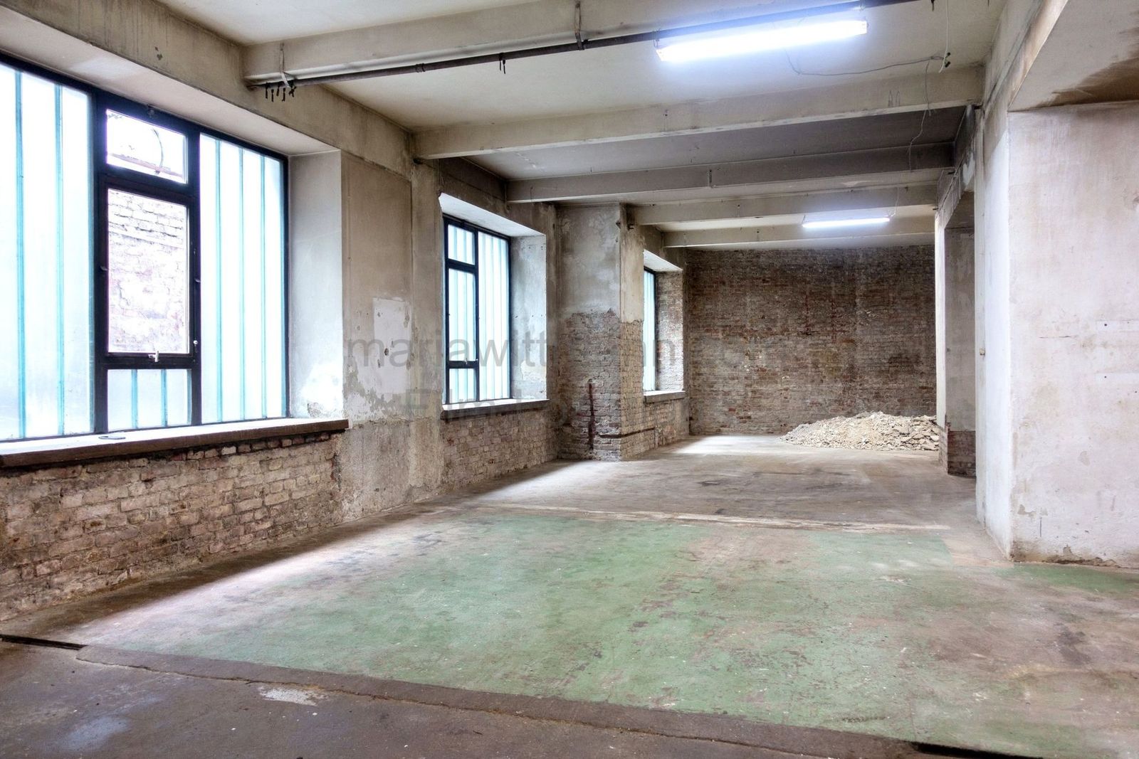 Raw Industrial Loft with Exposed Concrete and Brick - Photo 16