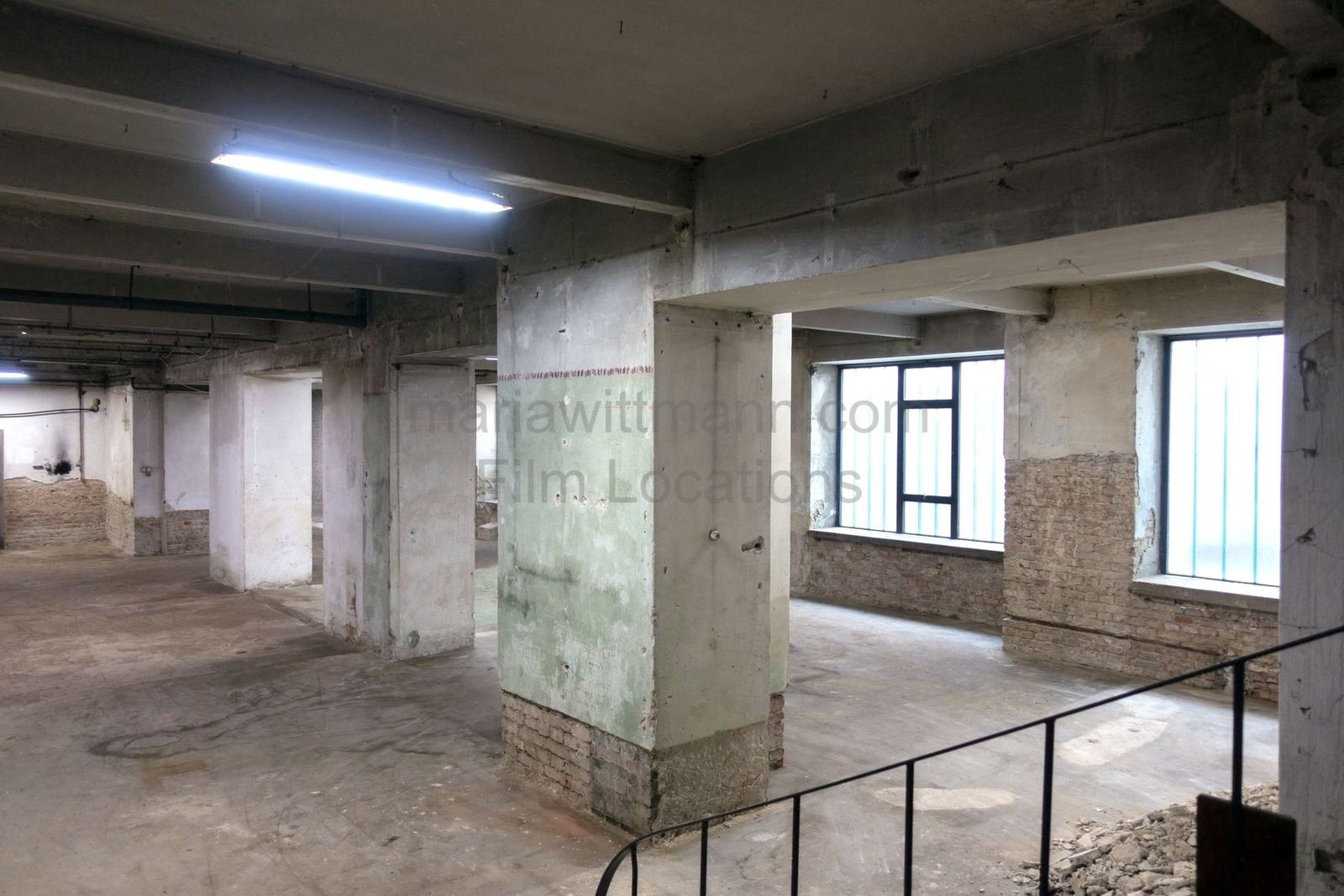 Raw Industrial Loft with Exposed Concrete and Brick - Photo 6