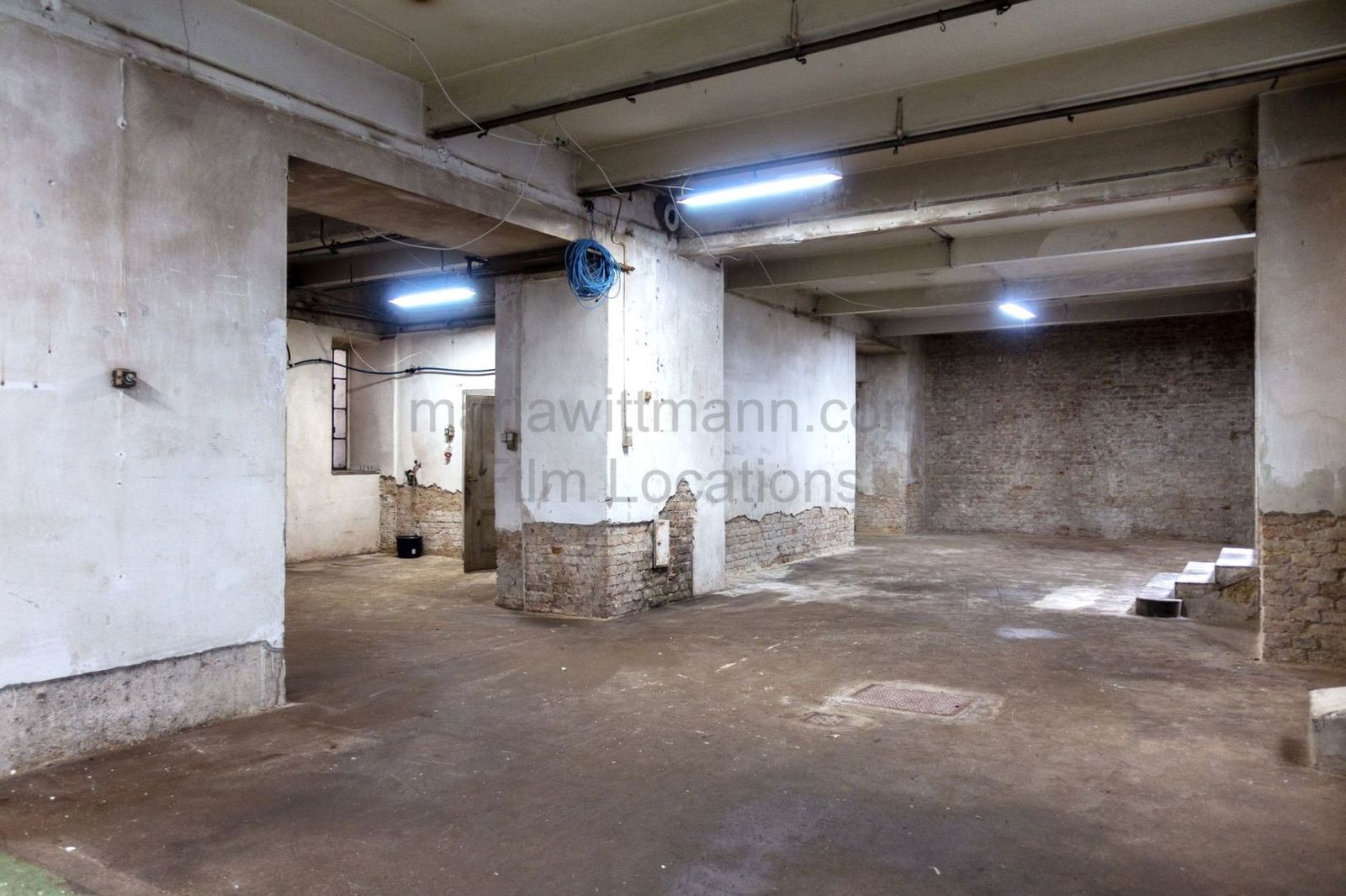 Raw Industrial Loft with Exposed Concrete and Brick - Photo 8