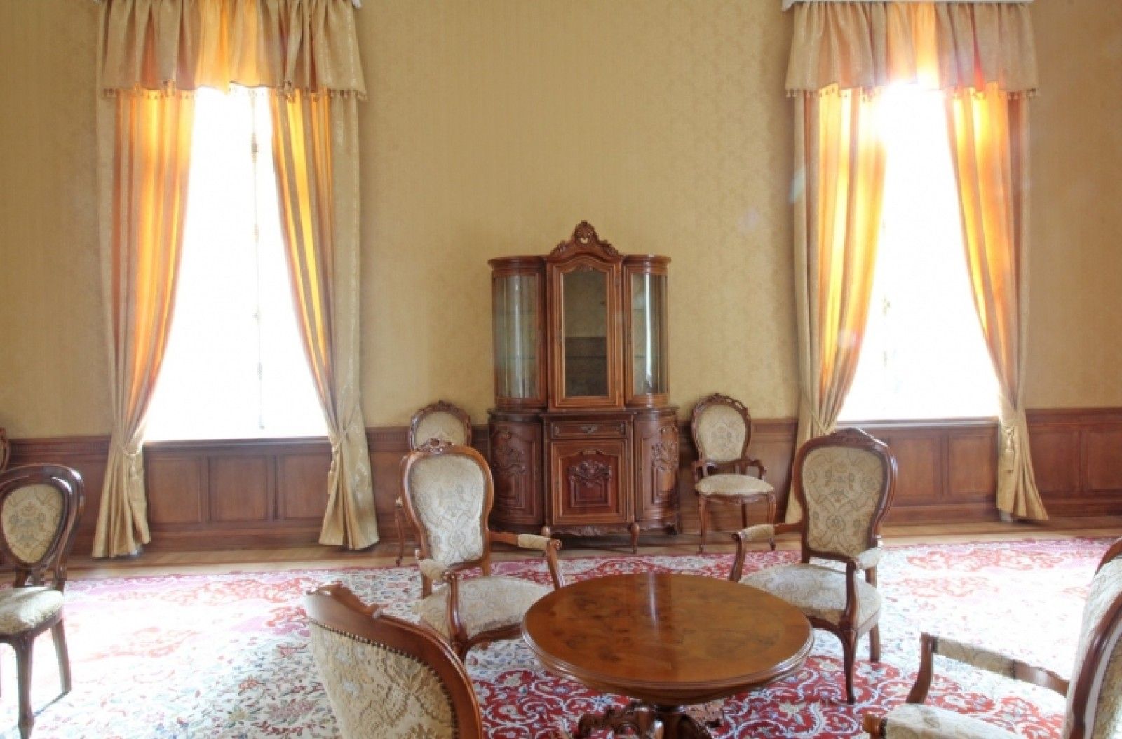 Palace in Louis XIII French château style characterized by jointed brickwork, a high mansard roof with copper cladding and a clock tower.