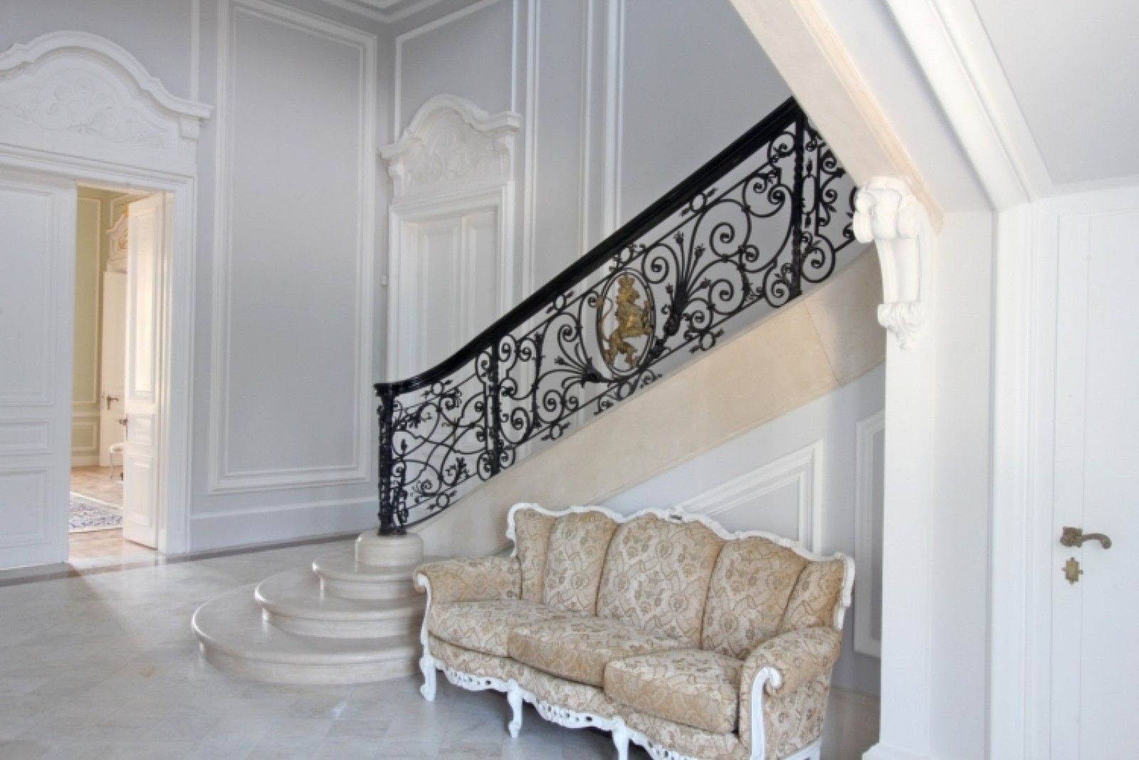 Palace in Louis XIII French château style characterized by jointed brickwork, a high mansard roof with copper cladding and a clock tower.