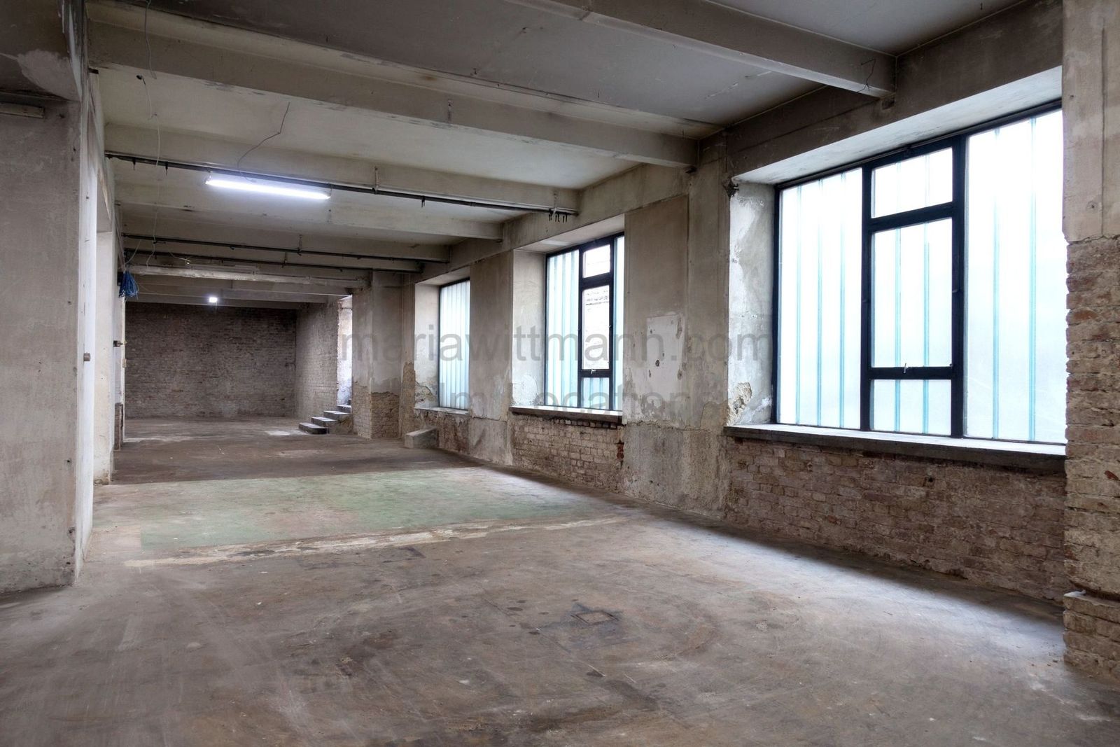 Raw Industrial Loft with Exposed Concrete and Brick - Photo 15