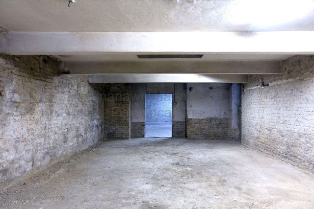 Raw Industrial Loft with Exposed Concrete and Brick