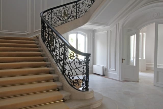 Evxinograd Palace, built in 1882, in Louis XIII French château style characterized by jointed brickwork, a high mansard roof with copper cladding and a clock tower.