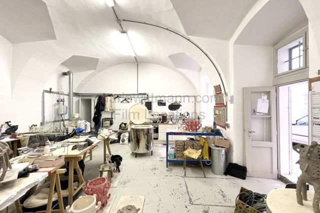 Industrial Vaulted Pottery Workshop with Brick Accent Wall