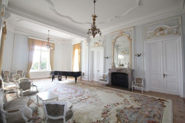 Evxinograd Palace, built in 1882, in Louis XIII French château style characterized by jointed brickwork, a high mansard roof with copper cladding and a clock tower.