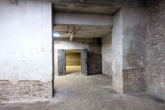 Raw Industrial Loft with Exposed Concrete and Brick