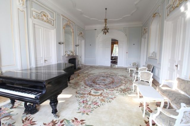 Evxinograd Palace, built in 1882, in Louis XIII French château style characterized by jointed brickwork, a high mansard roof with copper cladding and a clock tower.