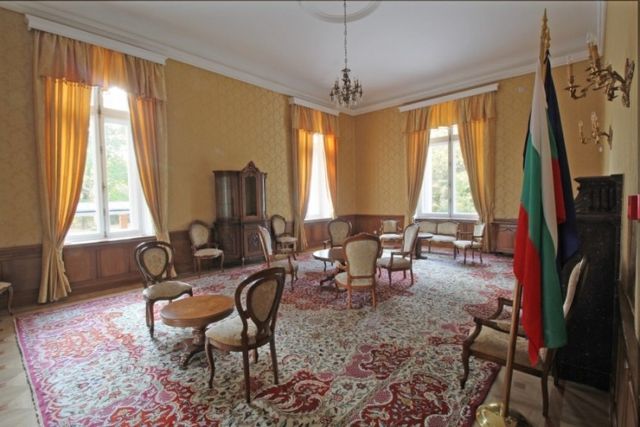Evxinograd Palace, built in 1882, in Louis XIII French château style characterized by jointed brickwork, a high mansard roof with copper cladding and a clock tower.