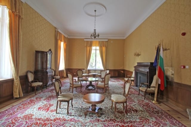 Evxinograd Palace, built in 1882, in Louis XIII French château style characterized by jointed brickwork, a high mansard roof with copper cladding and a clock tower.