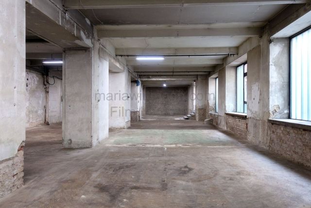 Raw Industrial Loft with Exposed Concrete and Brick