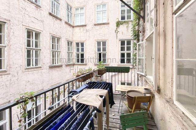 Historic Apartment with Tall Windows and High Ceilings