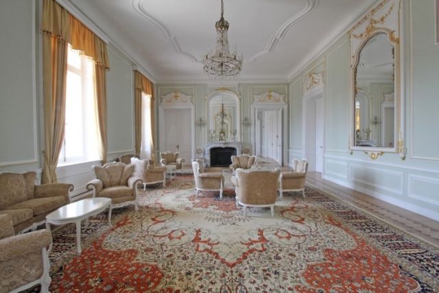 Evxinograd Palace, built in 1882, in Louis XIII French château style characterized by jointed brickwork, a high mansard roof with copper cladding and a clock tower.