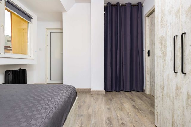 Top-Floor Flat with Balcony