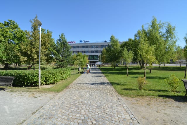 Big recognizable modern building with a bridge view of Sofia