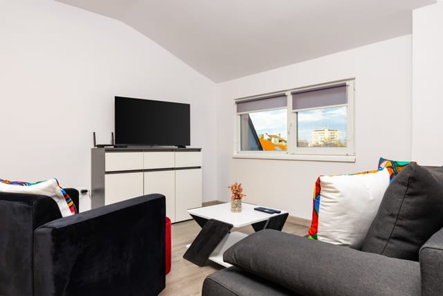 Top-Floor Flat with Balcony