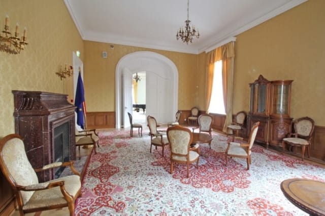 Evxinograd Palace, built in 1882, in Louis XIII French château style characterized by jointed brickwork, a high mansard roof with copper cladding and a clock tower.