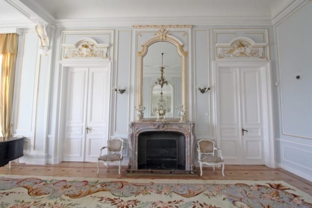 Evxinograd Palace, built in 1882, in Louis XIII French château style characterized by jointed brickwork, a high mansard roof with copper cladding and a clock tower.