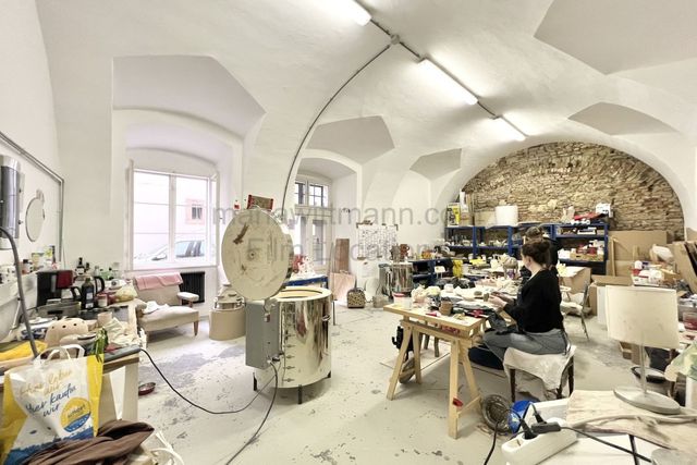 Industrial Vaulted Pottery Workshop with Brick Accent Wall
