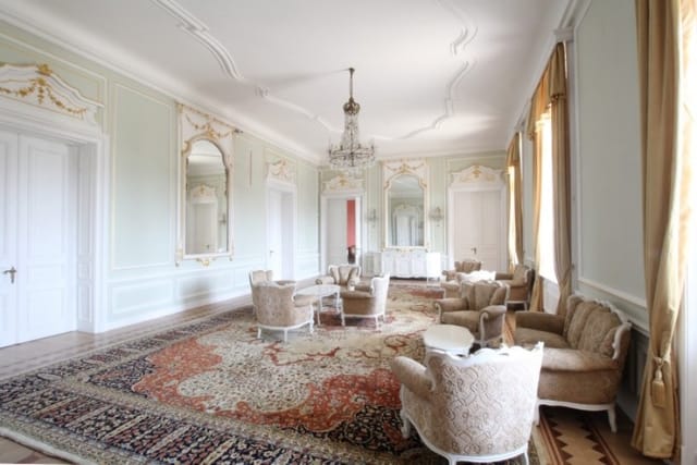 Evxinograd Palace, built in 1882, in Louis XIII French château style characterized by jointed brickwork, a high mansard roof with copper cladding and a clock tower.