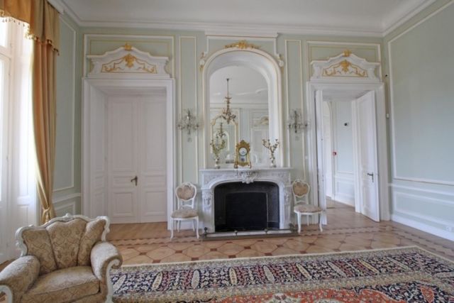 Evxinograd Palace, built in 1882, in Louis XIII French château style characterized by jointed brickwork, a high mansard roof with copper cladding and a clock tower.