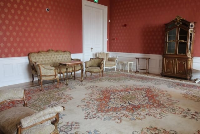 Evxinograd Palace, built in 1882, in Louis XIII French château style characterized by jointed brickwork, a high mansard roof with copper cladding and a clock tower.