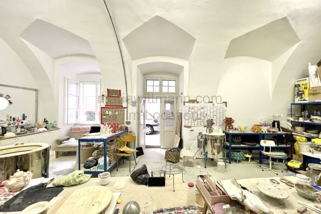 Industrial Vaulted Pottery Workshop with Brick Accent Wall