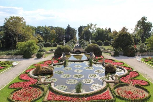 Evxinograd Palace, built in 1882, in Louis XIII French château style characterized by jointed brickwork, a high mansard roof with copper cladding and a clock tower.