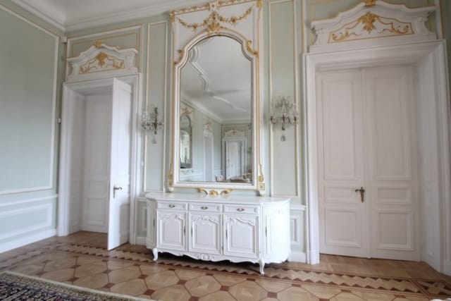 Evxinograd Palace, built in 1882, in Louis XIII French château style characterized by jointed brickwork, a high mansard roof with copper cladding and a clock tower.