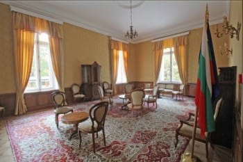 Evxinograd Palace, built in 1882, in Louis XIII French château style characterized by jointed brickwork, a high mansard roof with copper cladding and a clock tower.