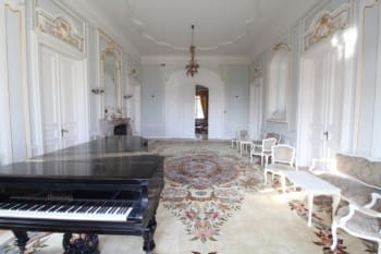 Evxinograd Palace, built in 1882, in Louis XIII French château style characterized by jointed brickwork, a high mansard roof with copper cladding and a clock tower.