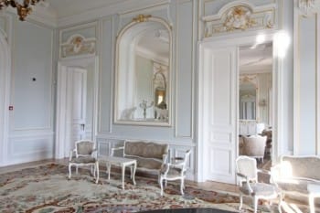 Evxinograd Palace, built in 1882, in Louis XIII French château style characterized by jointed brickwork, a high mansard roof with copper cladding and a clock tower.