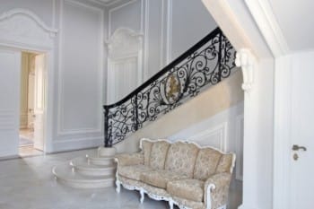 Evxinograd Palace, built in 1882, in Louis XIII French château style characterized by jointed brickwork, a high mansard roof with copper cladding and a clock tower.