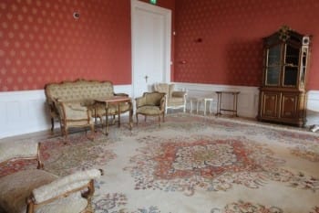 Evxinograd Palace, built in 1882, in Louis XIII French château style characterized by jointed brickwork, a high mansard roof with copper cladding and a clock tower.