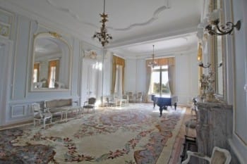 Evxinograd Palace, built in 1882, in Louis XIII French château style characterized by jointed brickwork, a high mansard roof with copper cladding and a clock tower.