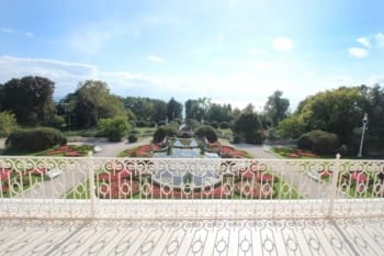 Evxinograd Palace, built in 1882, in Louis XIII French château style characterized by jointed brickwork, a high mansard roof with copper cladding and a clock tower.